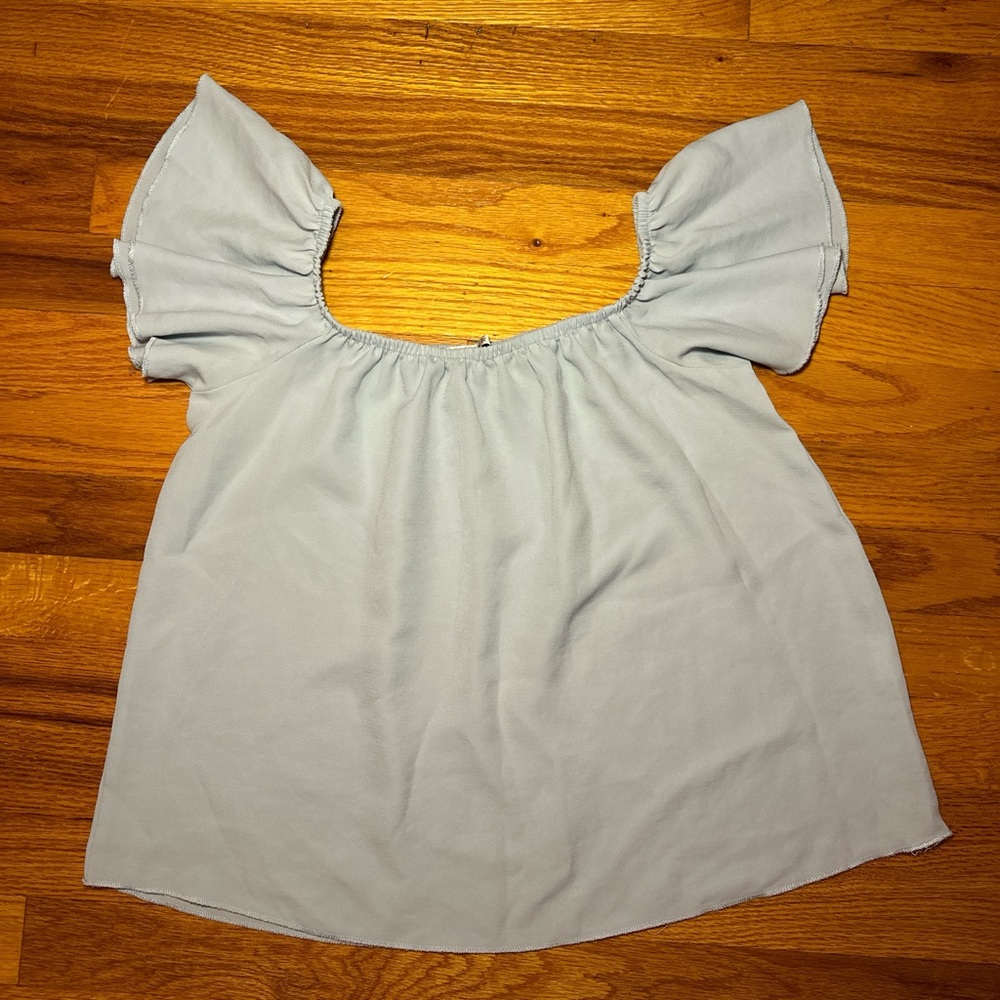 Blue off the shoulder ruffled blouse